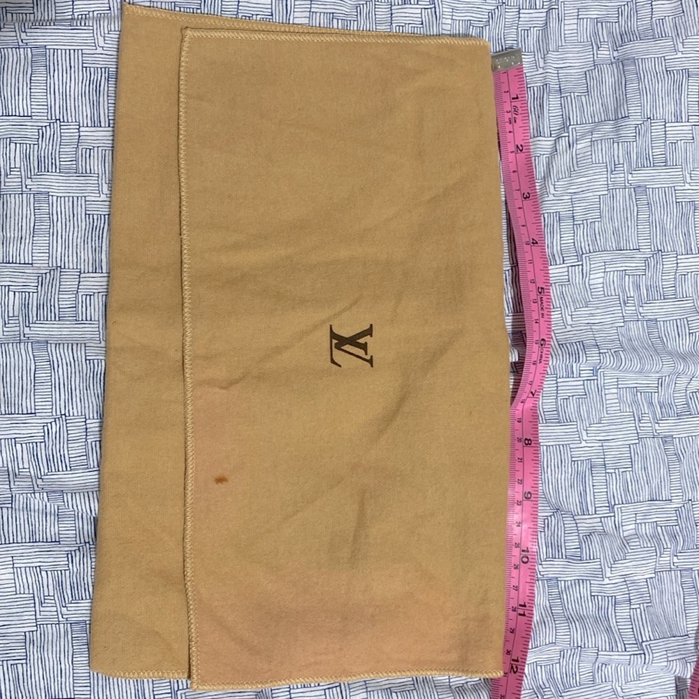 Small LV dustbag 7 inches by 11 3/4 inches with small stain in front